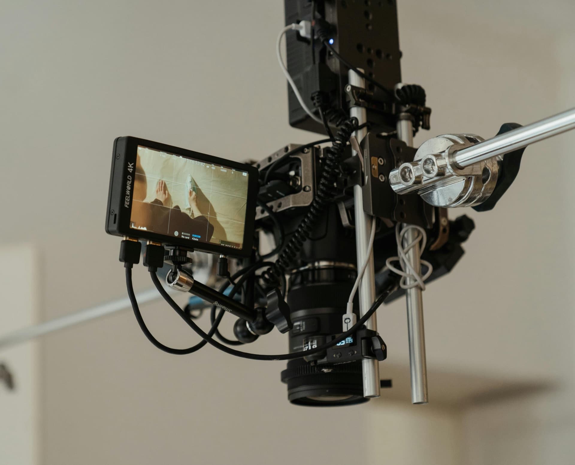 Overhead shot of a podcast desk mid-recording with two microphones and a laptop.